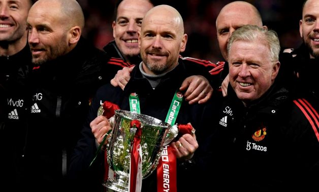 Manchester United manager Erik ten Hag with coaching staff celebrate with the trophy after winning the Carabao Cup REUTERS/Tony Obrien/File Photo
