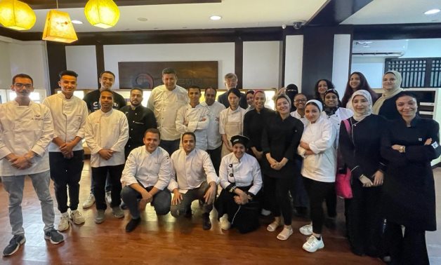 Korean Chef Hong Seng Hee and Egyptian professional Chefs pose for a picture at the Korean Cultural Center in cairo-Samar Samir/Egypt Today .jpeg